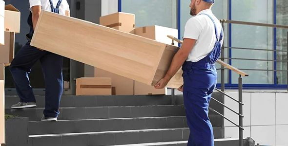 Movers carrying furniture for apartment moving in South Bend, IN.