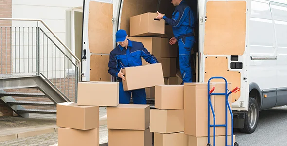 Movers loading boxes onto a truck for emergency moving service in La Porte, IN.