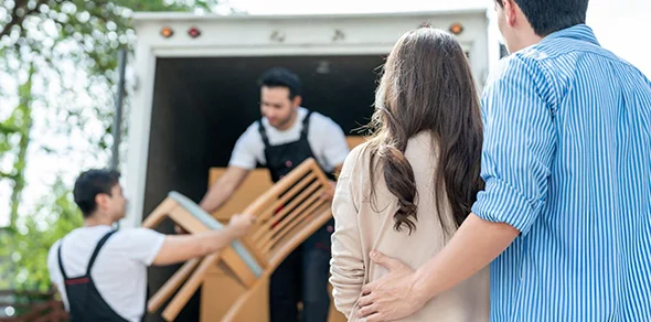 Family oversees movers loading furniture for loading and unloading services in Elkhart, IN.