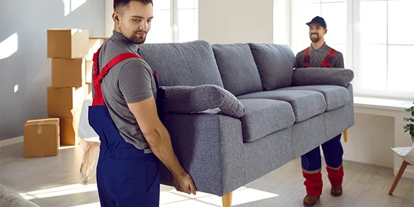 Movers delivering a couch for same day furniture delivery service in Granger, IN.